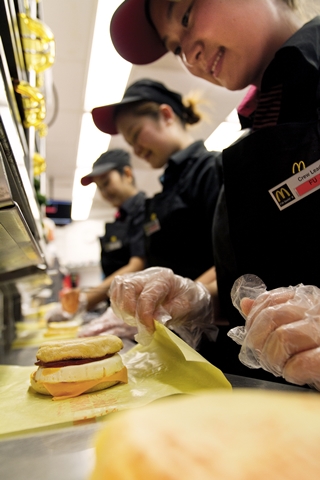 McDonald's crew preparing Egg McMuffins